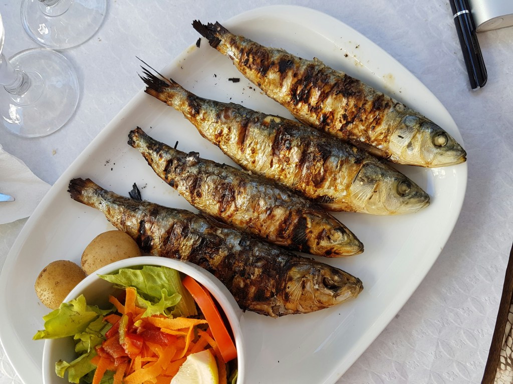A plate of grilled sardines