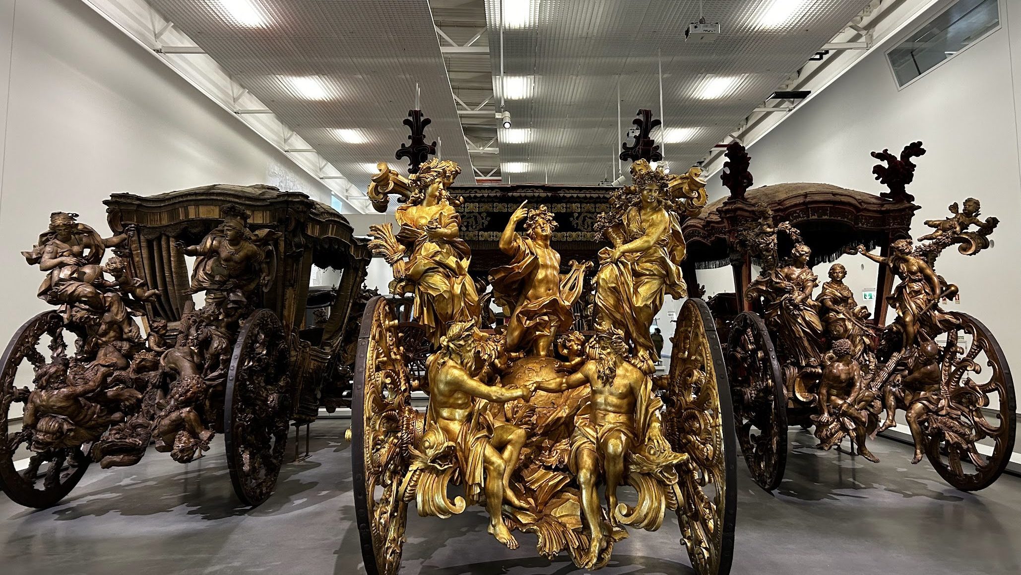 g]Golden carriages in a museum