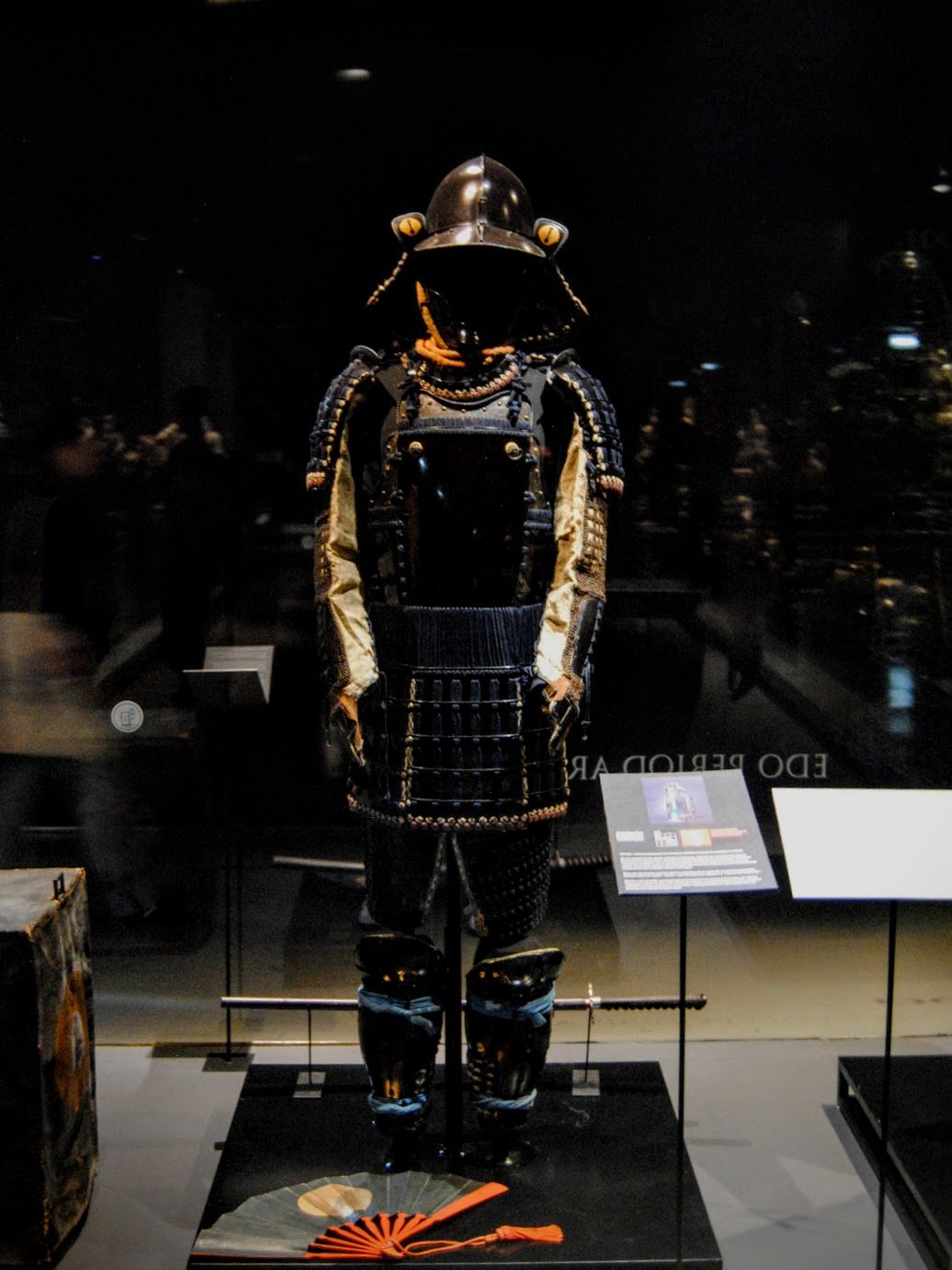 A black samurai set of armor in a museum